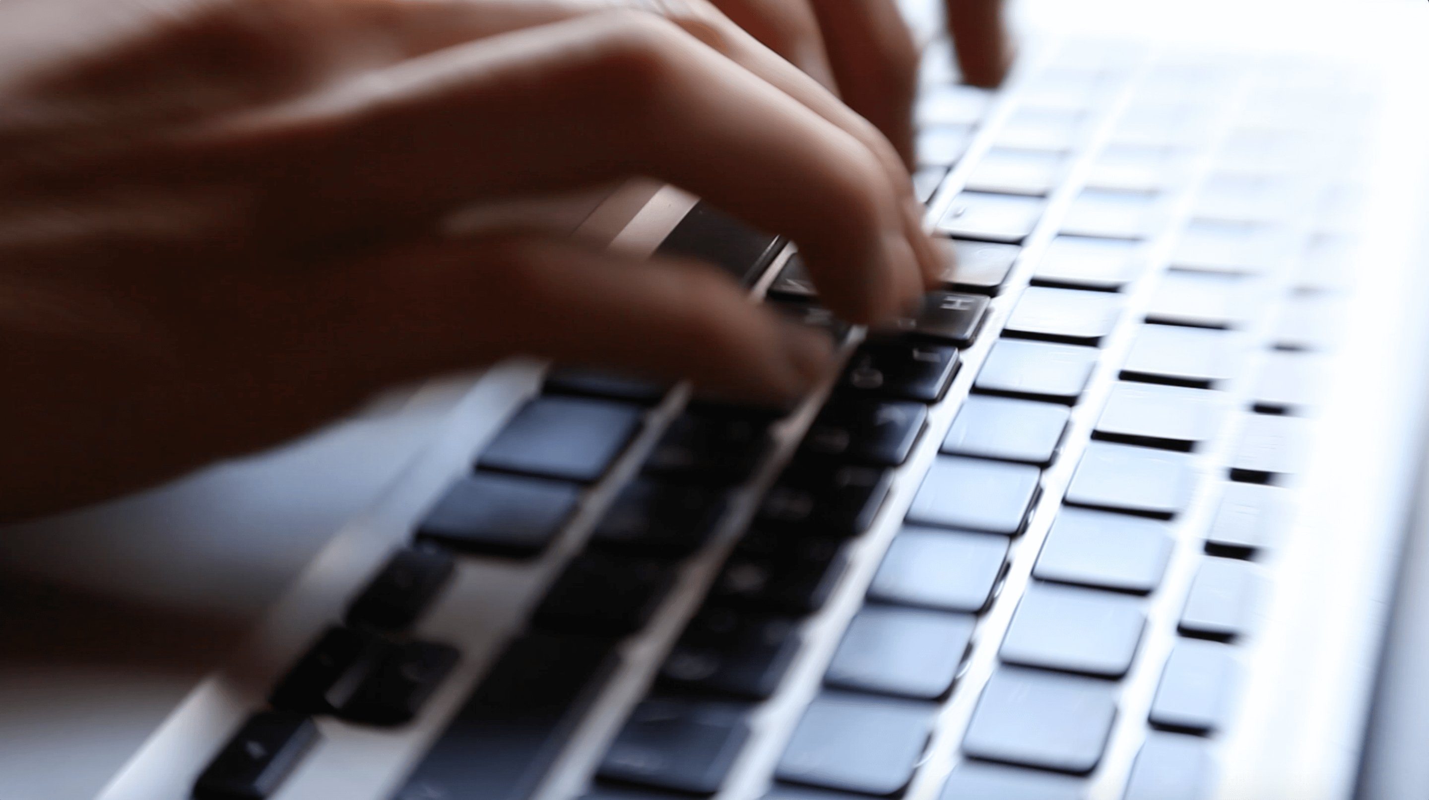person uses laptop to look up research on autism treatments