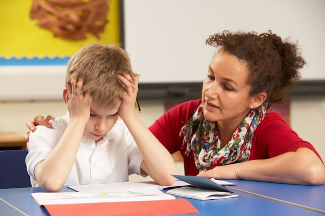woman works with young boy for Autism Career Opportunities