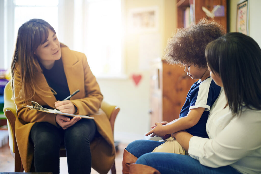 Mother, sad child and psychologist consultation in office for depression, anxiety or mental health. Psychology doctor, therapist or mama with boy for counselling, therapy or talking for healthcare. Mother, sad child and psychologist consultation in office for depression, anxiety or mental health. Psychology doctor, therapist or mama with boy for counselling, therapy or talking for healthcare.