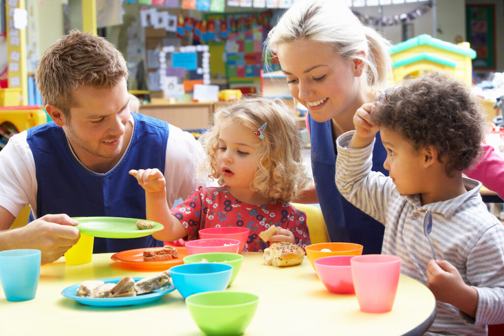 Couple and children playing with toys Couple and children playing with toys